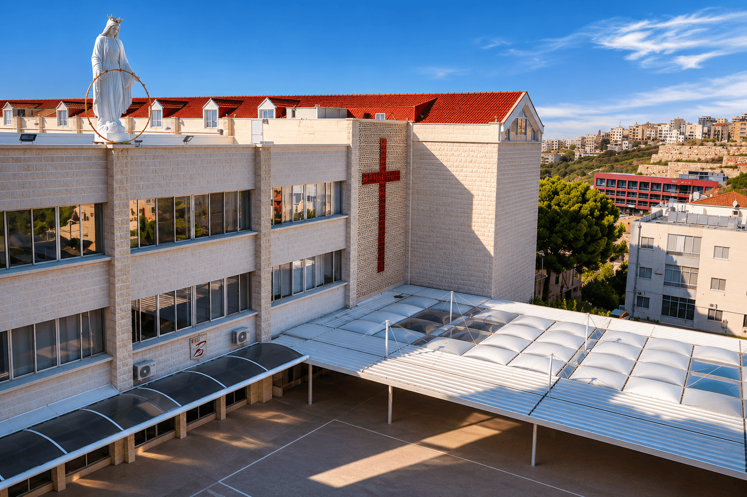 Rosary Sisters School campus with chapel cross and statue of the Virgin Mary
